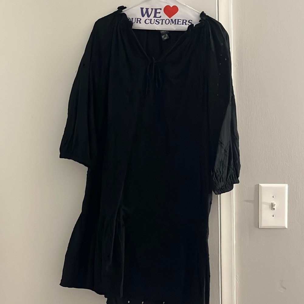 Eyelet black dress with ruffle bottom and tie at top